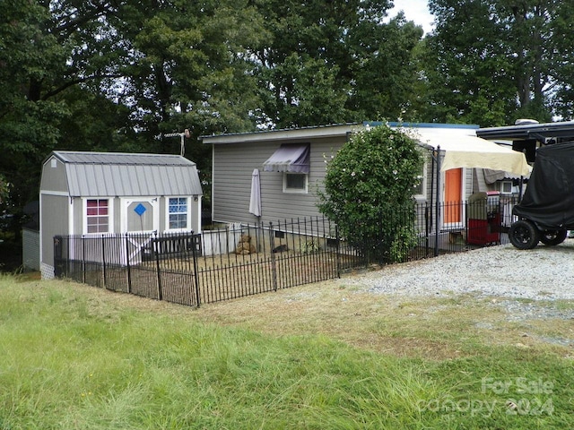 rear view of house with a shed