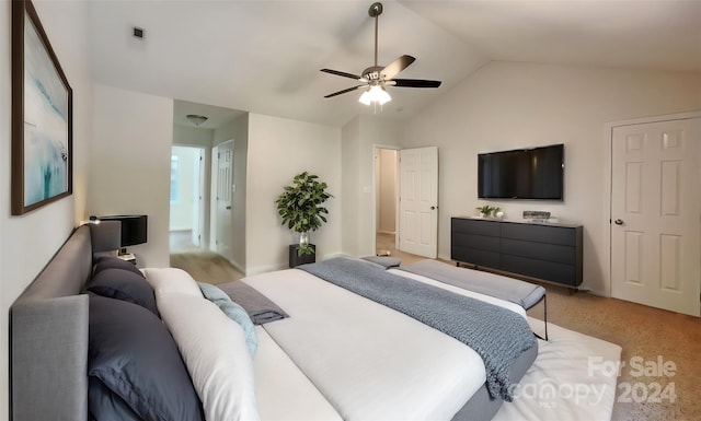 carpeted bedroom with vaulted ceiling and ceiling fan