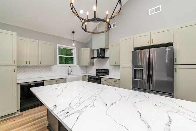 kitchen featuring visible vents, decorative backsplash, light stone countertops, black appliances, and pendant lighting