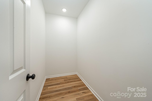 interior space with light wood-type flooring and baseboards