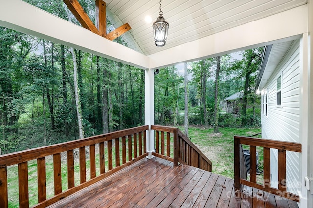 wooden deck with a yard