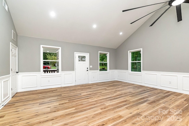 unfurnished room with visible vents, light wood-type flooring, a ceiling fan, and a healthy amount of sunlight