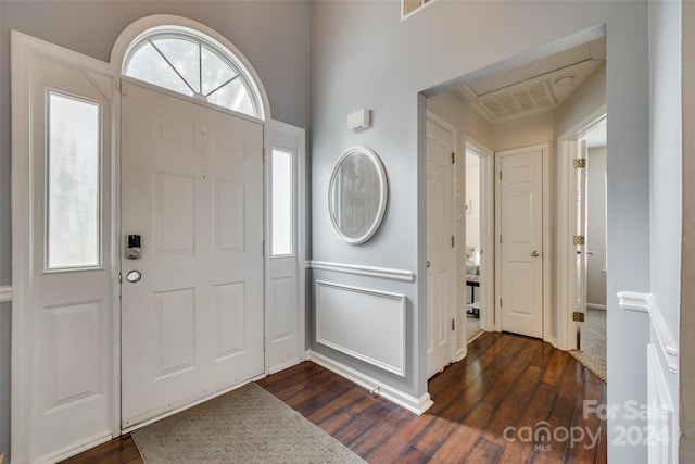 entryway featuring dark wood-type flooring and plenty of natural light