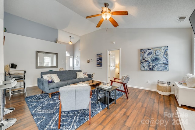 living room with a textured ceiling, ceiling fan, high vaulted ceiling, and dark hardwood / wood-style flooring