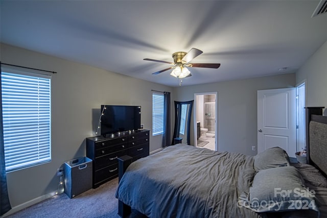 carpeted bedroom with ceiling fan and connected bathroom