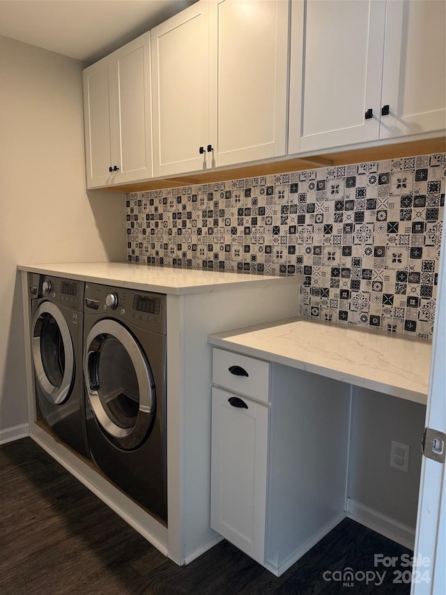 clothes washing area featuring cabinets, dark hardwood / wood-style flooring, and separate washer and dryer