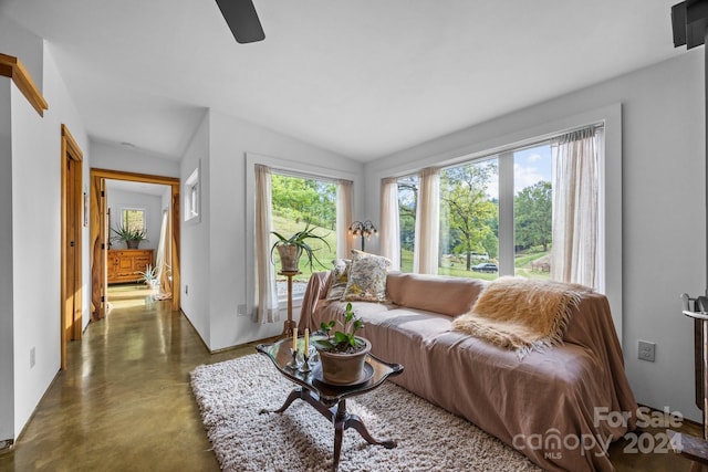 44 Brookside Dr, Burnsville, NC 28714 - living room with finished concrete flooring, a ceiling fan, and vaulted ceiling