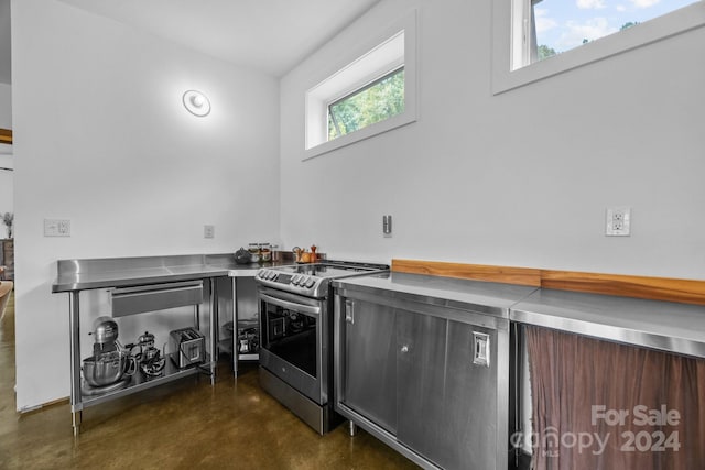 44 Brookside Dr, Burnsville, NC 28714 - kitchen featuring stainless steel counters, stainless steel electric range oven, concrete flooring, and modern cabinets