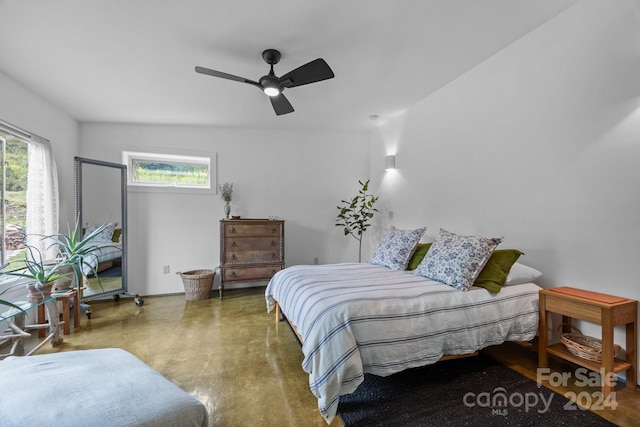 carpeted bedroom with vaulted ceiling and ceiling fan