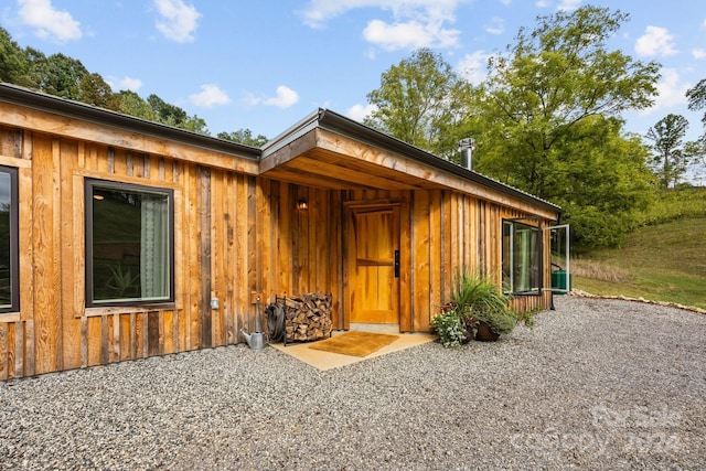 44 Brookside Dr, Burnsville, NC 28714 - doorway to property featuring board and batten siding