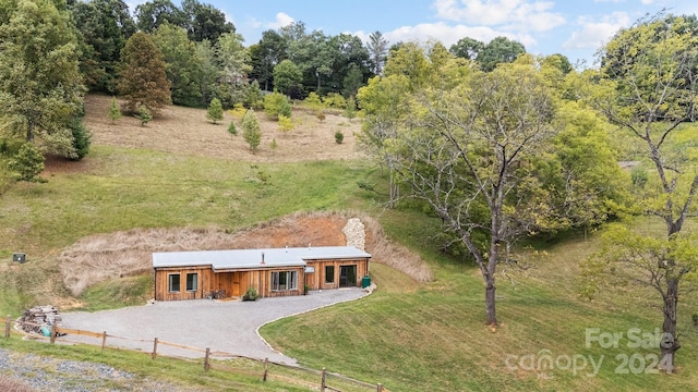 44 Brookside Dr, Burnsville, NC 28714 - view of front of property featuring gravel driveway and board and batten siding