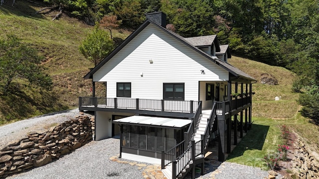 back of property featuring a sunroom