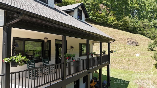 view of side of home with a porch