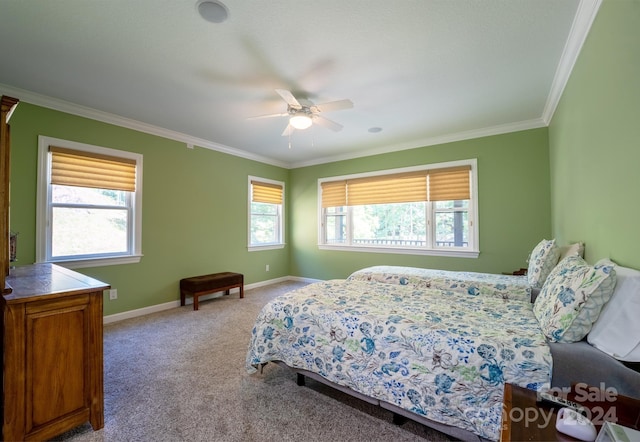 bedroom with multiple windows, ceiling fan, light colored carpet, and crown molding