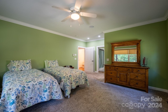 carpeted bedroom with ceiling fan, ornamental molding, and ensuite bathroom