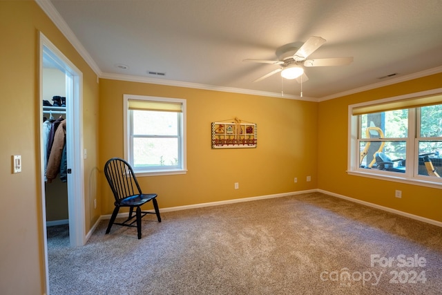 unfurnished room featuring crown molding, ceiling fan, and carpet floors