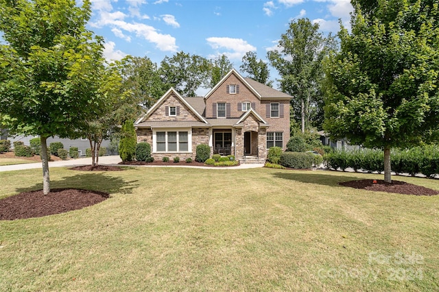 craftsman-style house with a front yard