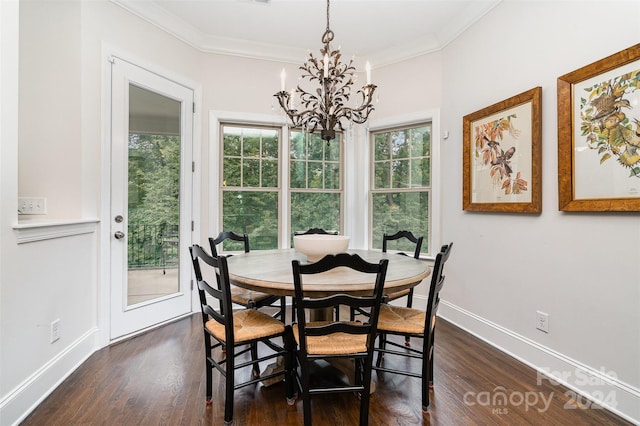 dining area with dark hardwood / wood-style floors, a chandelier, crown molding, and a healthy amount of sunlight