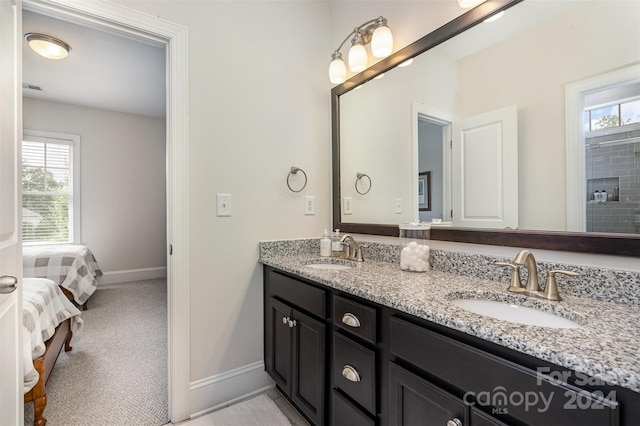 bathroom with plenty of natural light and vanity