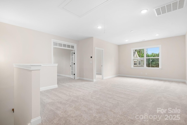 empty room featuring light colored carpet