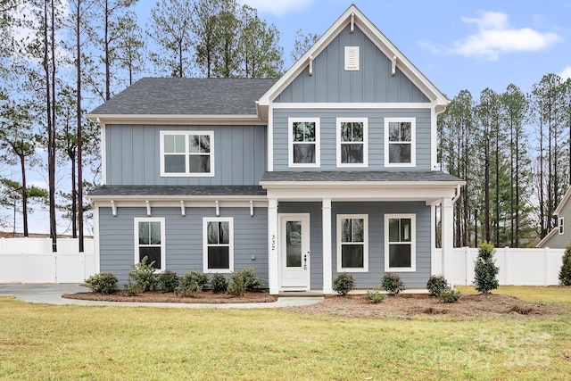 view of front facade featuring a front lawn and covered porch