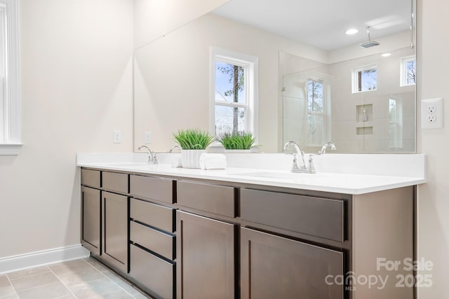 bathroom featuring vanity, tile patterned floors, and a shower with shower door