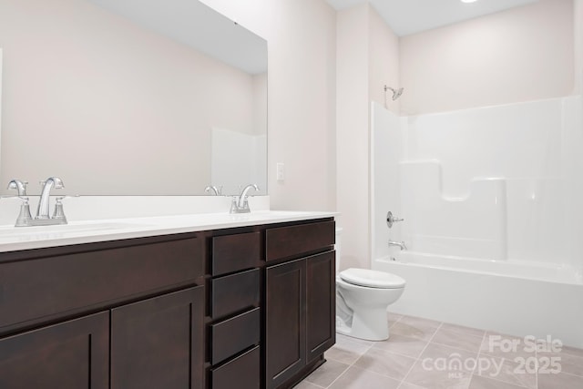 full bathroom featuring vanity, bathtub / shower combination, tile patterned floors, and toilet