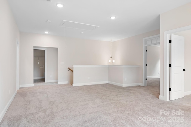 unfurnished room featuring light colored carpet