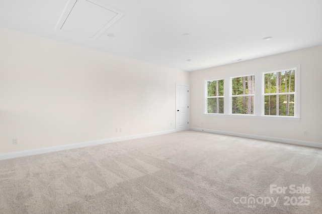 empty room featuring light carpet