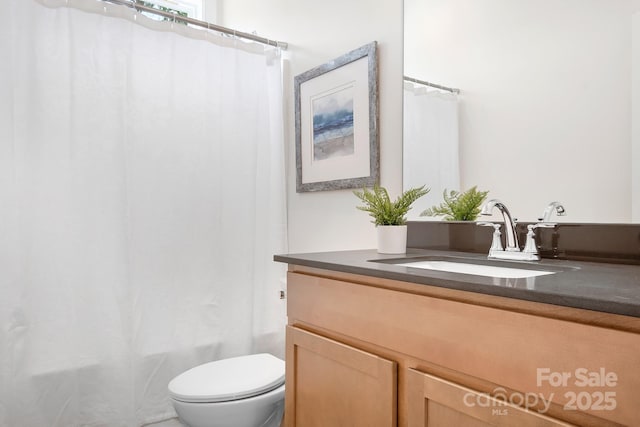 full bathroom featuring vanity, toilet, and shower / bath combo with shower curtain