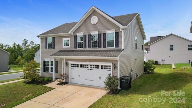 front facade featuring a front yard, central AC unit, and a garage