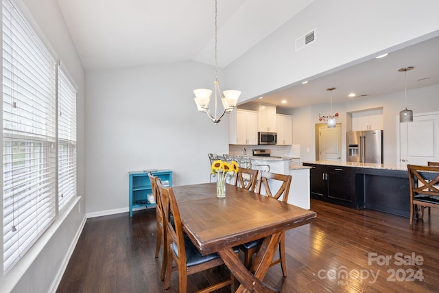 dining area with lofted ceiling, a notable chandelier, and dark hardwood / wood-style flooring