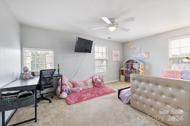 bedroom featuring light colored carpet and ceiling fan