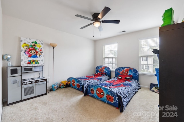 carpeted bedroom with ceiling fan