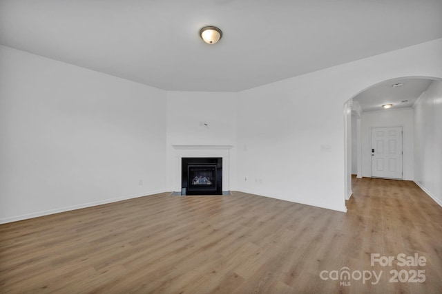 unfurnished living room with light hardwood / wood-style flooring