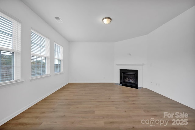 unfurnished living room featuring light hardwood / wood-style floors