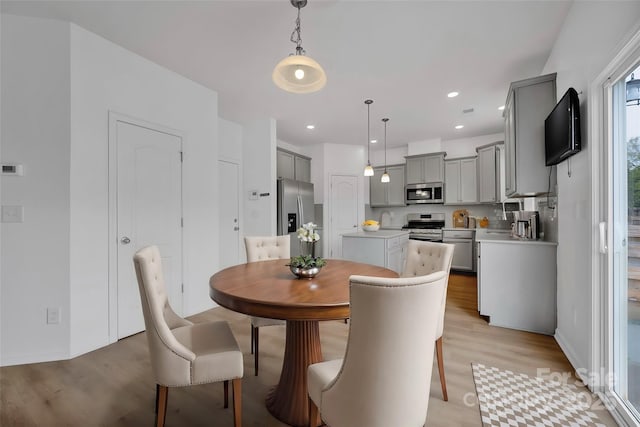 dining room featuring light wood-type flooring