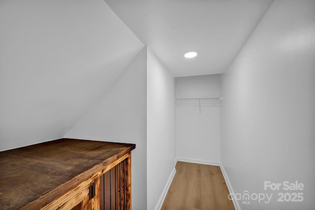 walk in closet featuring light hardwood / wood-style floors