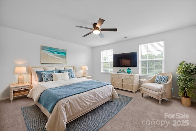 carpeted bedroom with ceiling fan