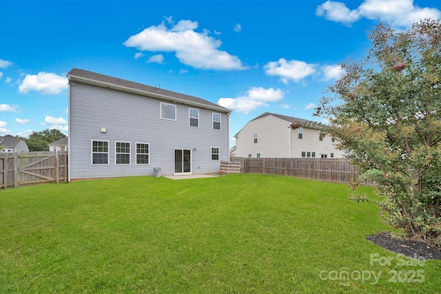 back of house with a yard and a patio