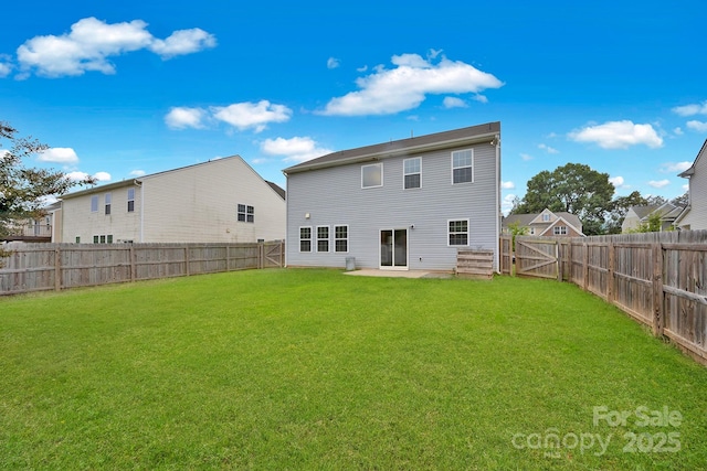 back of property featuring a yard and a patio