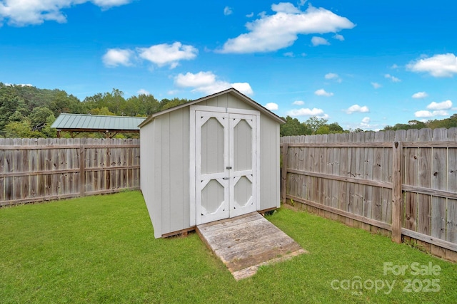 view of outbuilding with a lawn