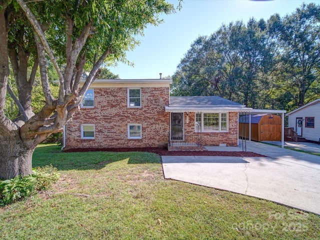 split level home with a shed and a front yard