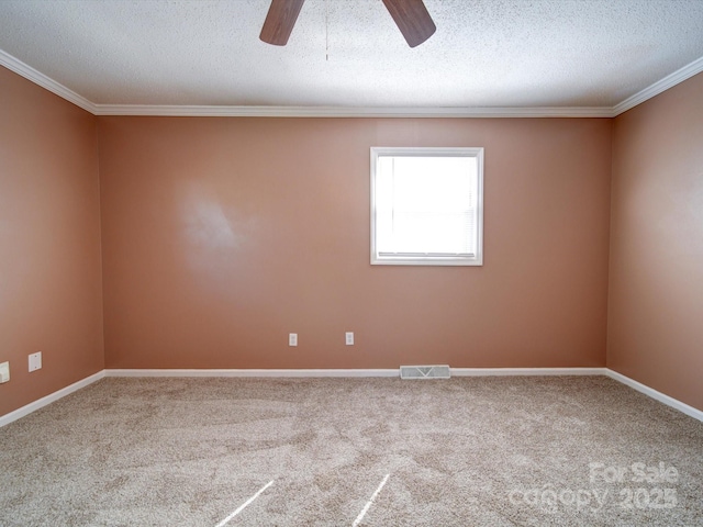 carpeted empty room with crown molding, ceiling fan, and a textured ceiling