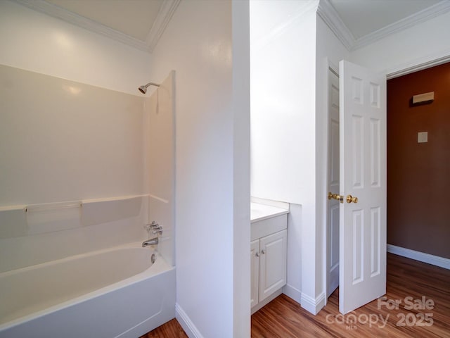 bathroom featuring hardwood / wood-style floors, vanity, and ornamental molding