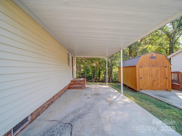 view of patio featuring a shed