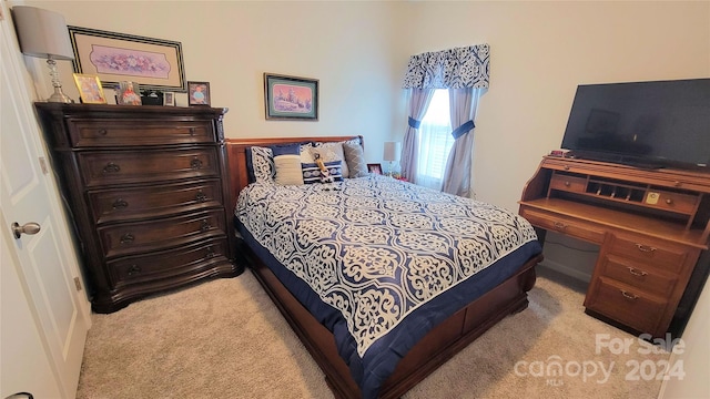 bedroom with light carpet