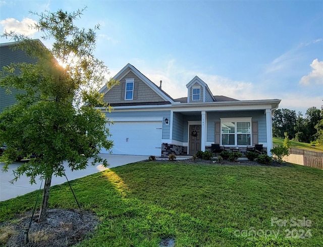 craftsman-style home with a front lawn and covered porch