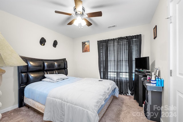 bedroom with light carpet and ceiling fan