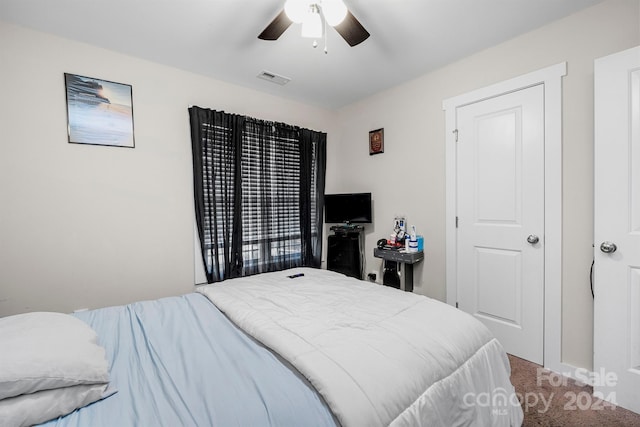 bedroom with ceiling fan and carpet